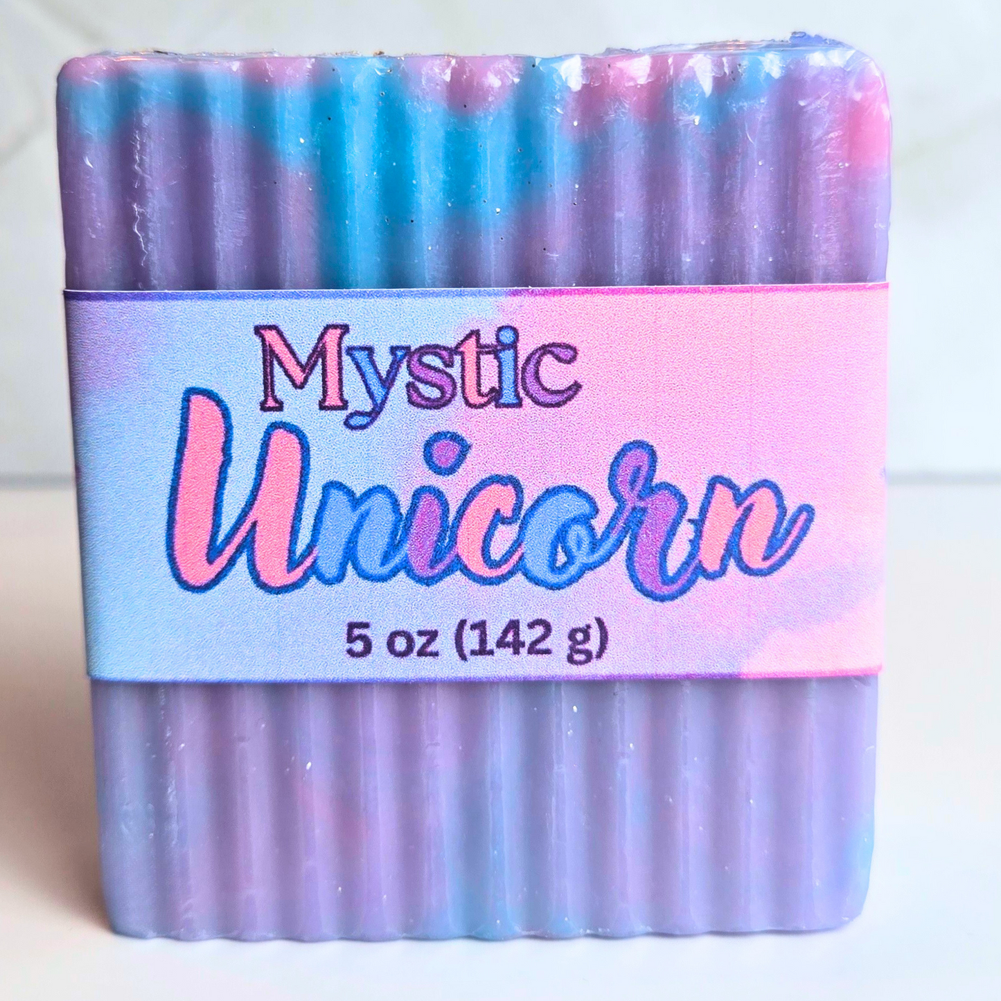 Mystical unicorn soap with pastel swirls and glitter—handcrafted bar perfect for magical self-care and gifting