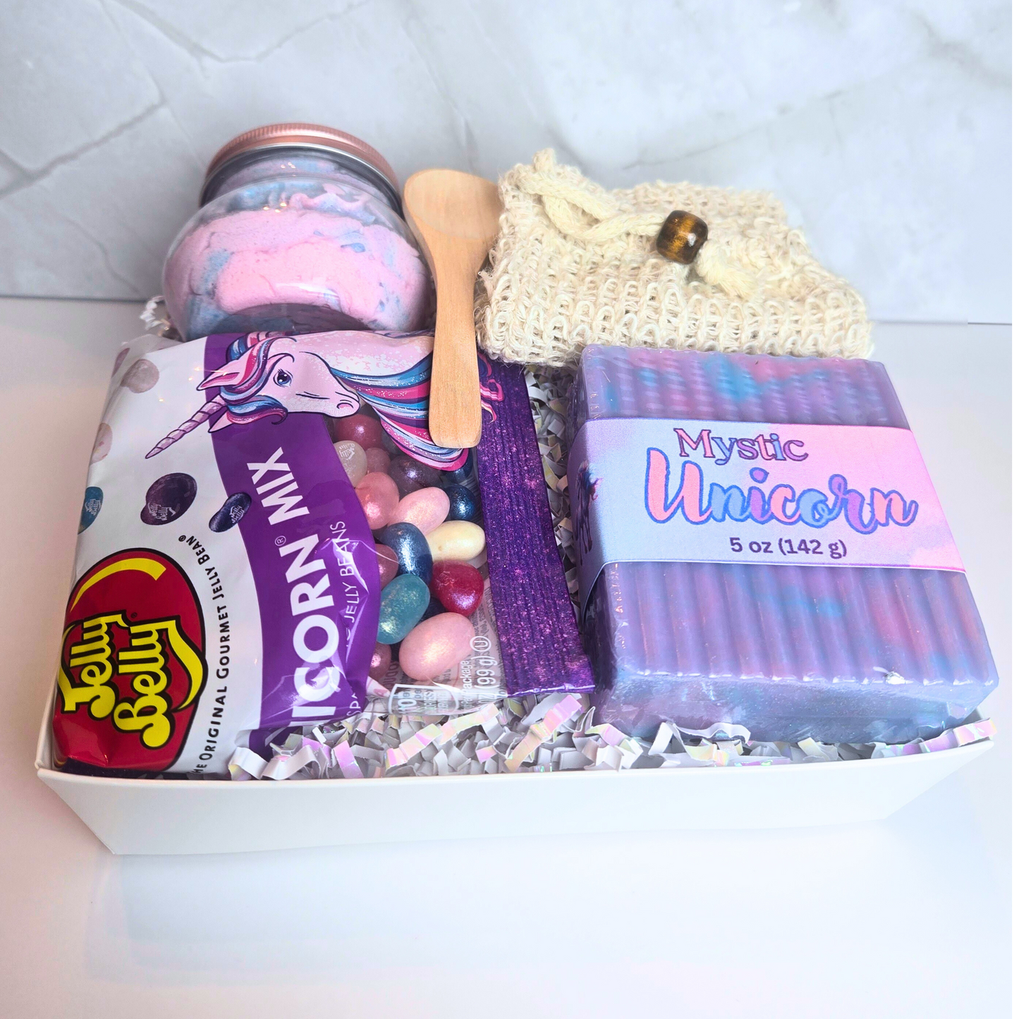 Colorful unicorn-themed gift box with curated spa products and treats—ideal gift unicorn lovers.