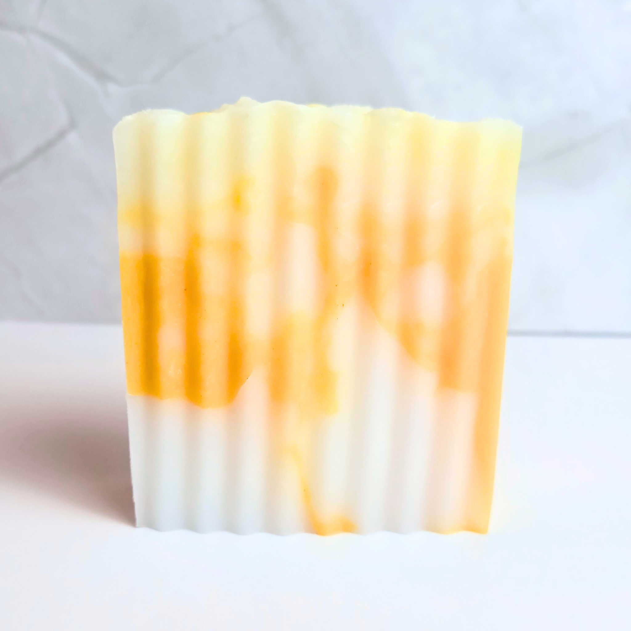 Luxurious handcrafted soap with exotic pineapple fragrance, front view.
