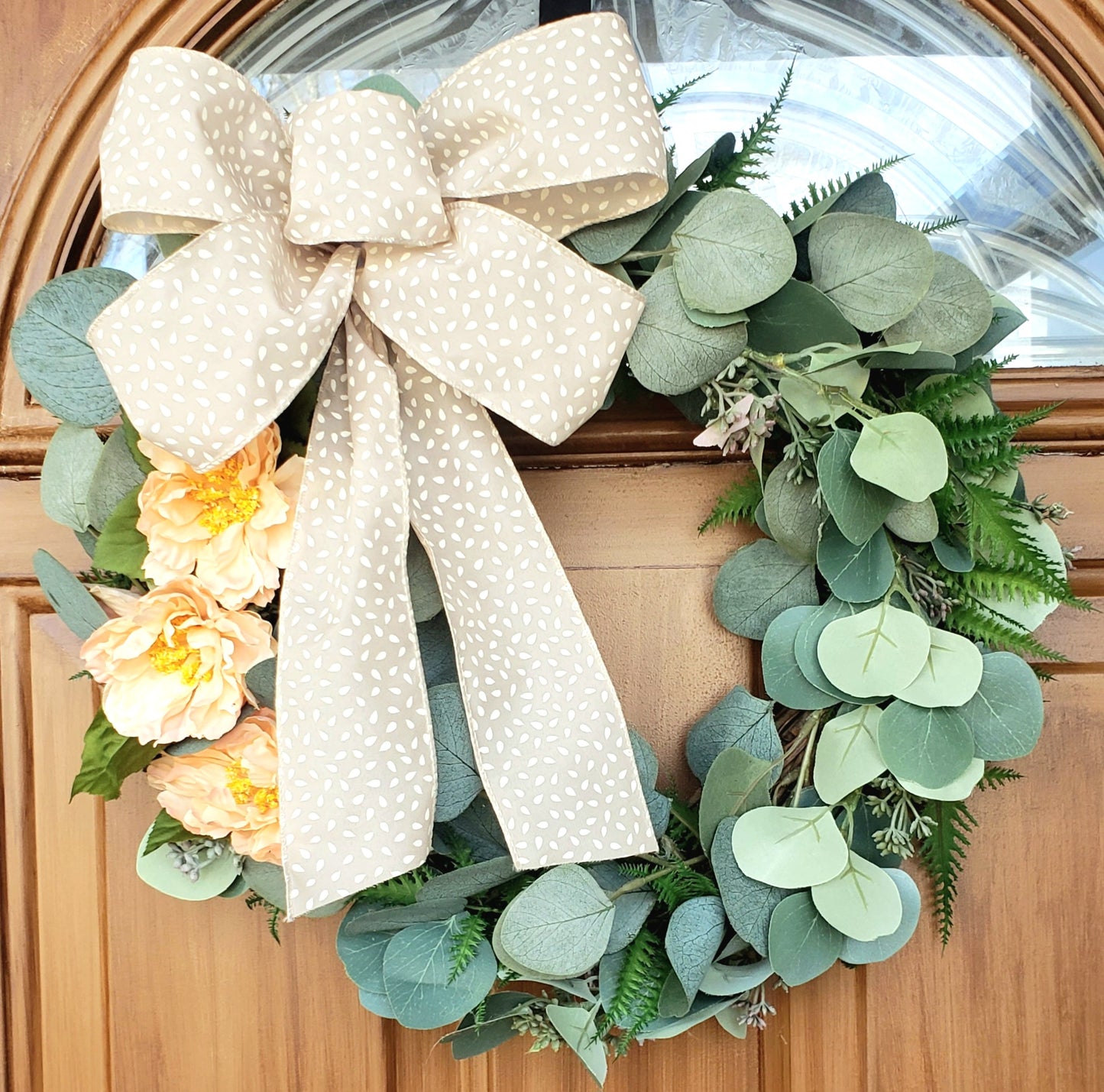 Farmhouse style Eucalyptus Wreath with Carnation Accents for gift or self, front view.