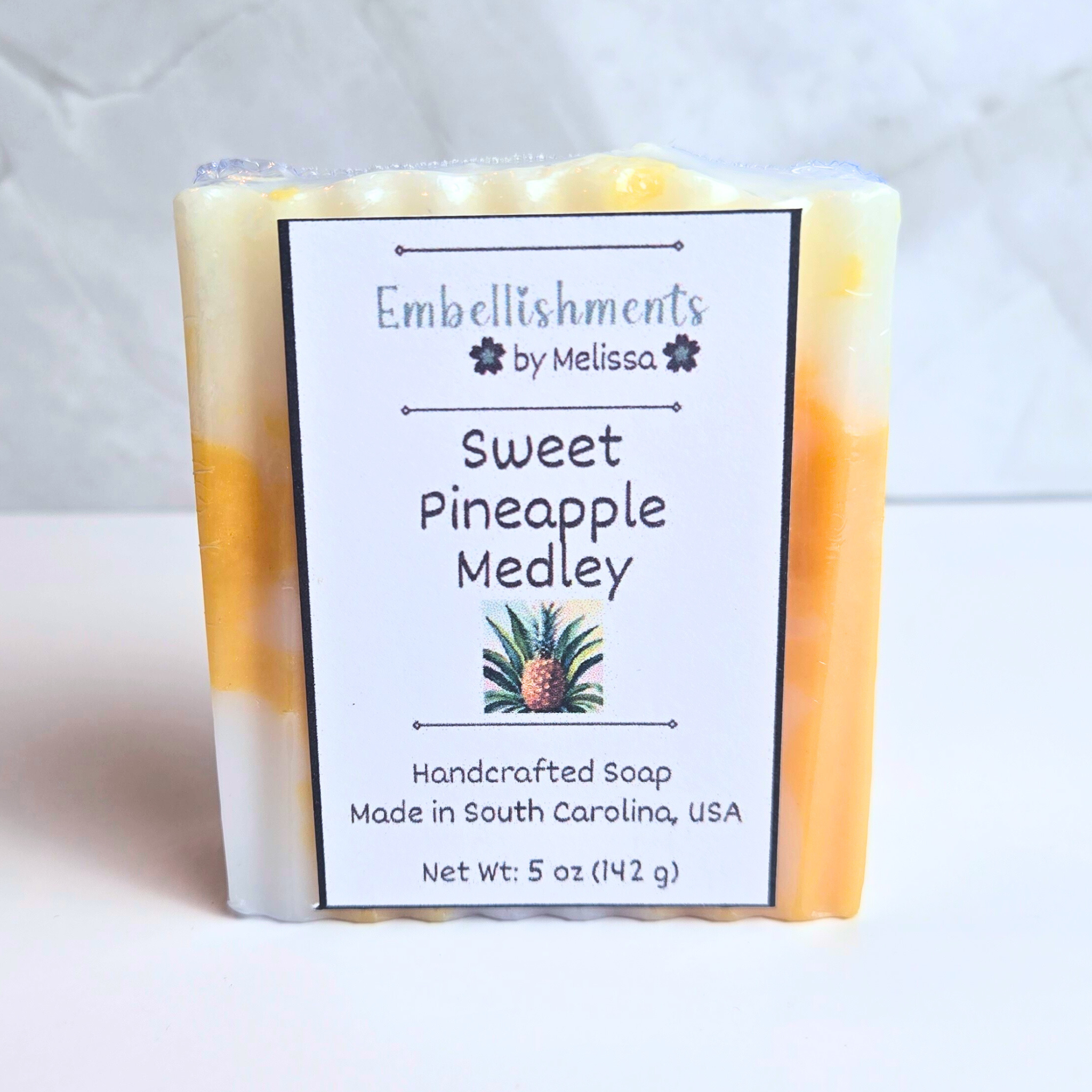 Artisan soap featuring a vibrant pineapple medley fragrance, front view.