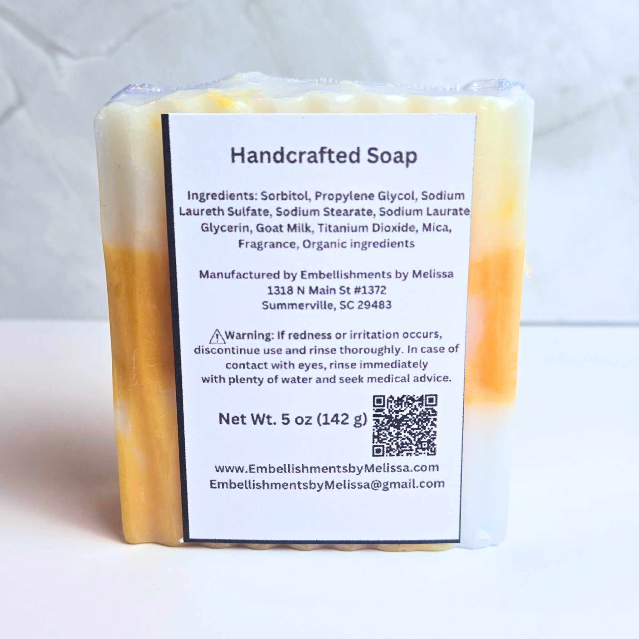 Fruit-scented handmade soap with pineapple and citrus infusion, back view.