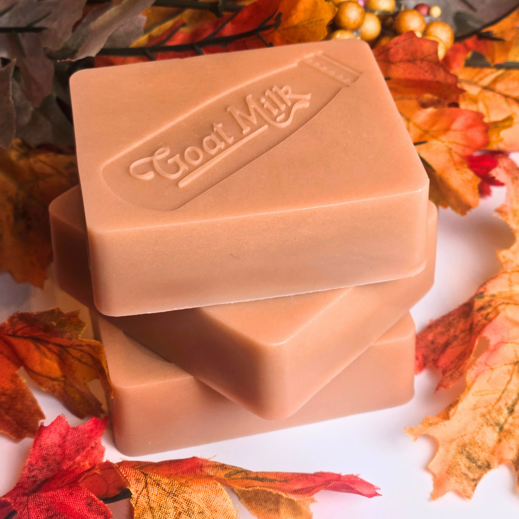 Creamy pumpkin pie-scented goat milk soap, handmade for fall, top view.