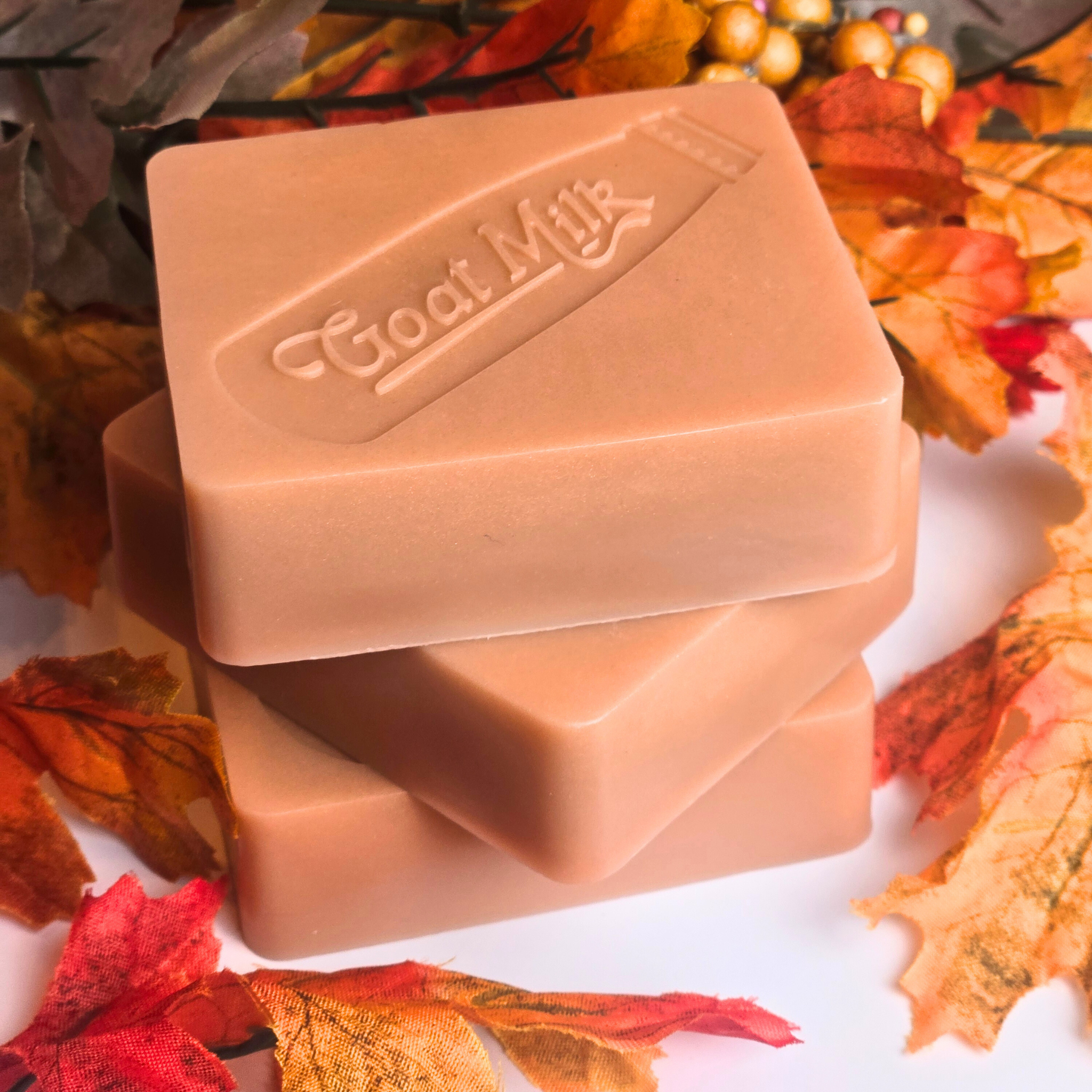 Creamy pumpkin pie-scented goat milk soap, handmade for fall, top view.