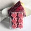 Close-up of red velvet cake soy wax melts with creamy, dessert-inspired texture and deep red color
