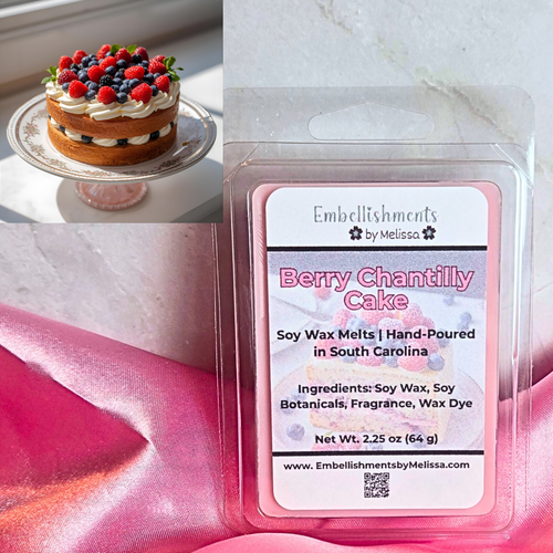 Soy wax melt package labeled 'Berry Chantilly Cake' by Embellishments by Melissa on a pink fabric background.