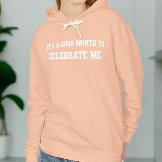 Peach-colored birthday shirt stating, "It's a good month to celebrate me."