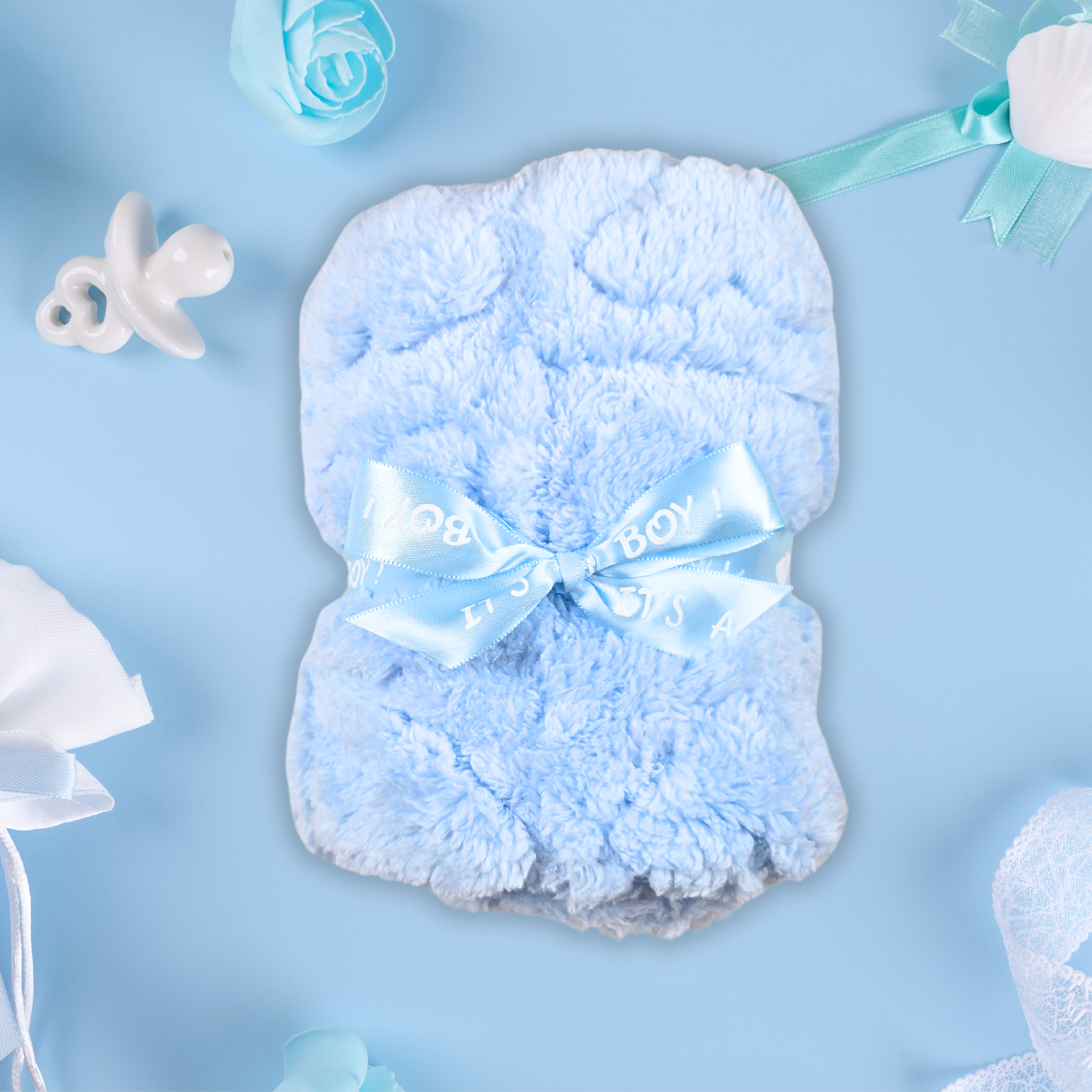 Lightweight baby blue swaddle blanket, perfect for naps, included in  gift box, top view.