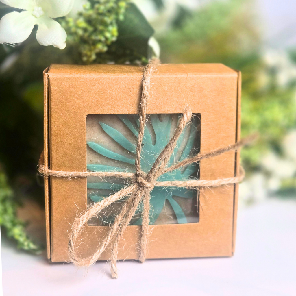 Artisan soap bars made with oatmeal and kaolin clay, emitting a sweet and earthy honeybee aroma, front view.