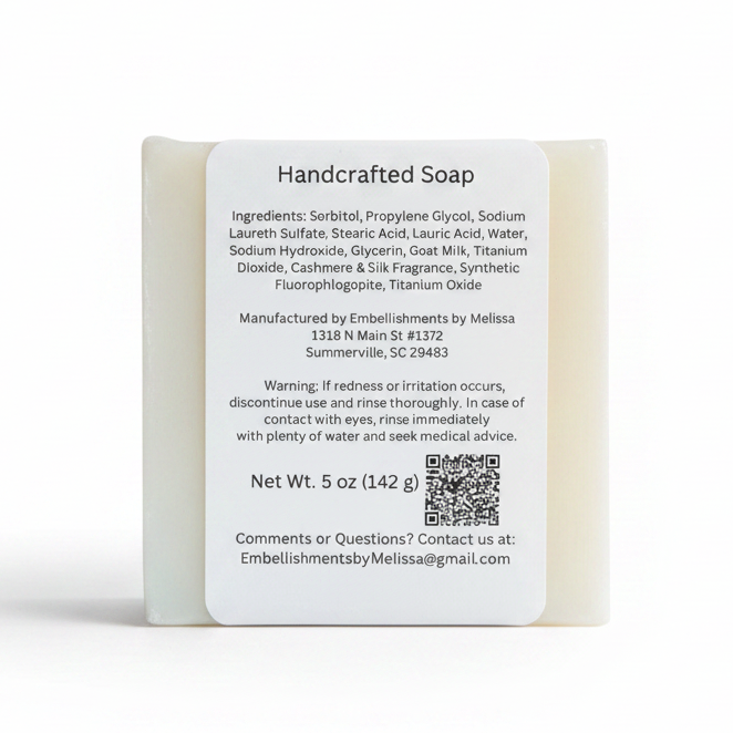 A single rectangular bar of soap standing upright on a white background, with a large white label showing product details, ingredients, manufacturer information, and a QR code.