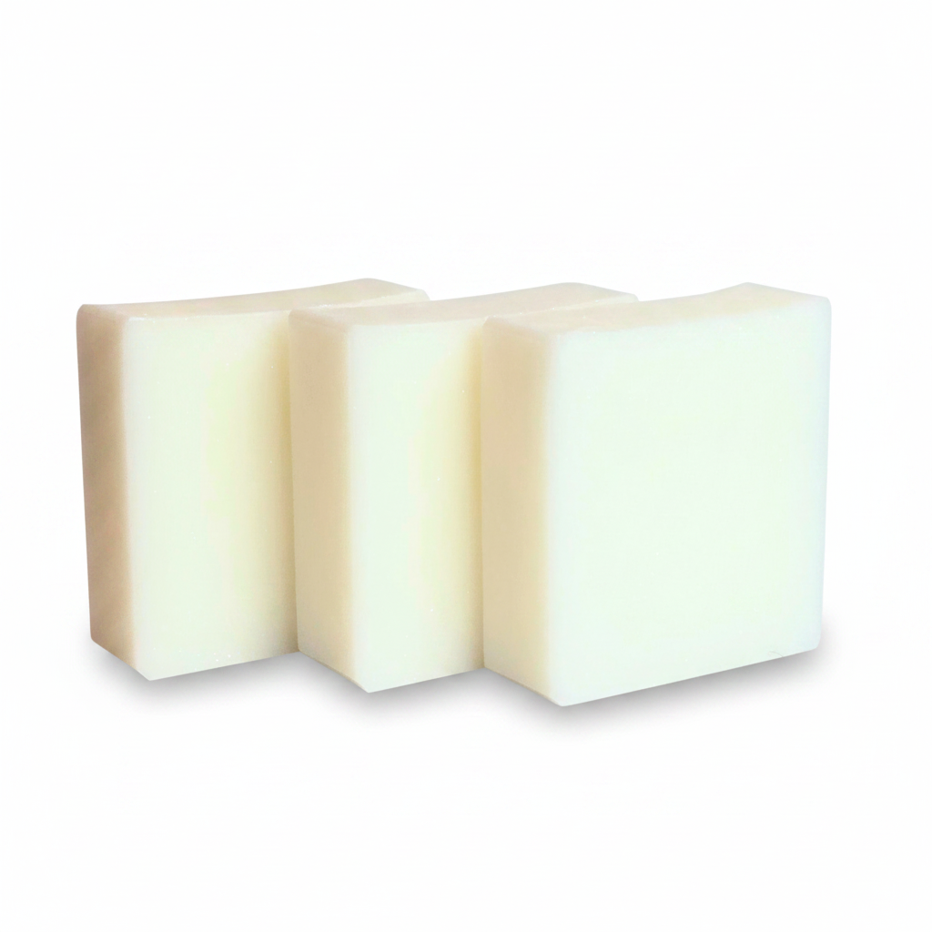 Three rectangular bars of creamy off-white soap standing upright against a plain white background.