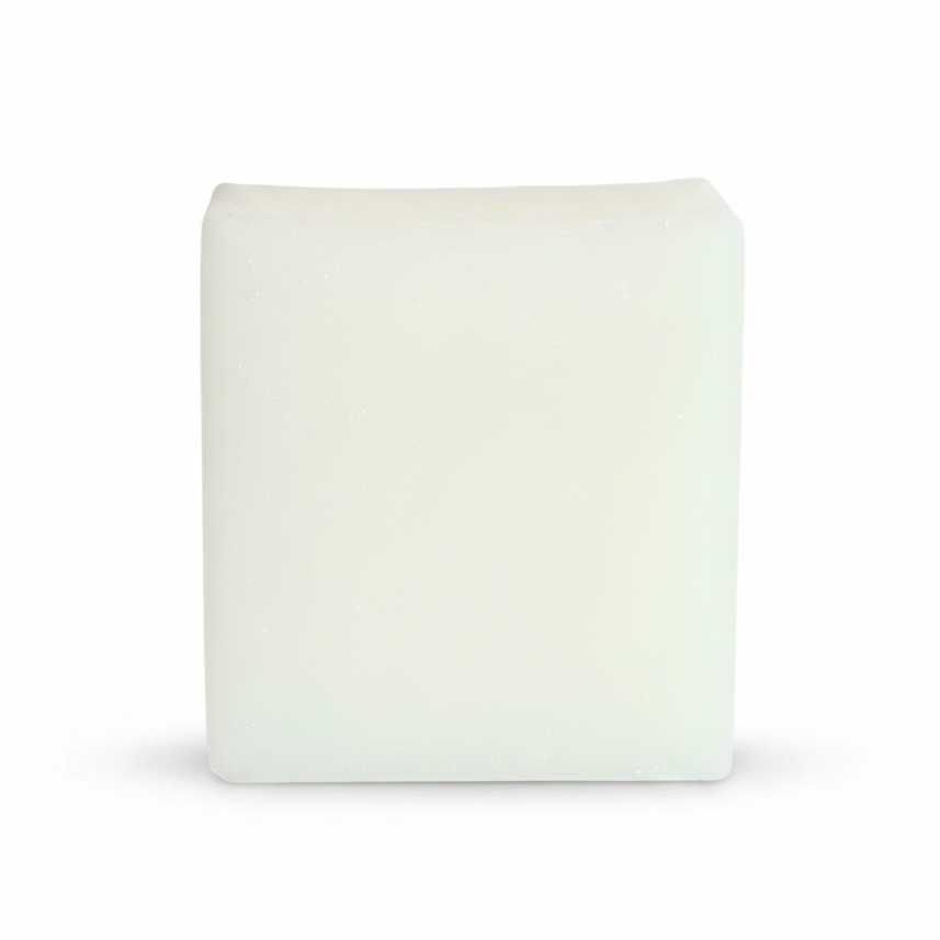 A square, off-white solid bar, likely a soap bar or wax melt, shown against a plain white background.