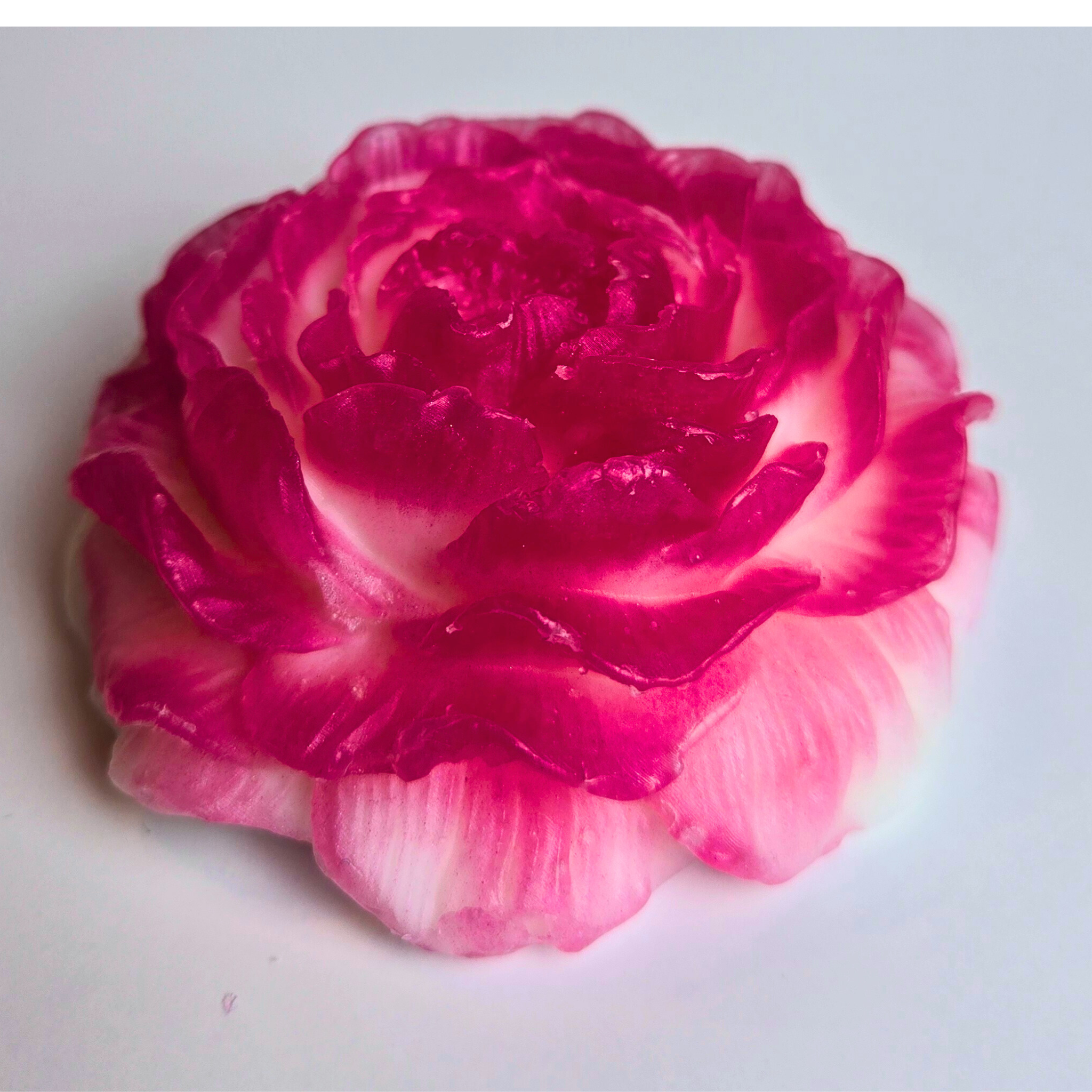 Cherry blossom-scented soap in a floral shape, handcrafted for elegance, front view.