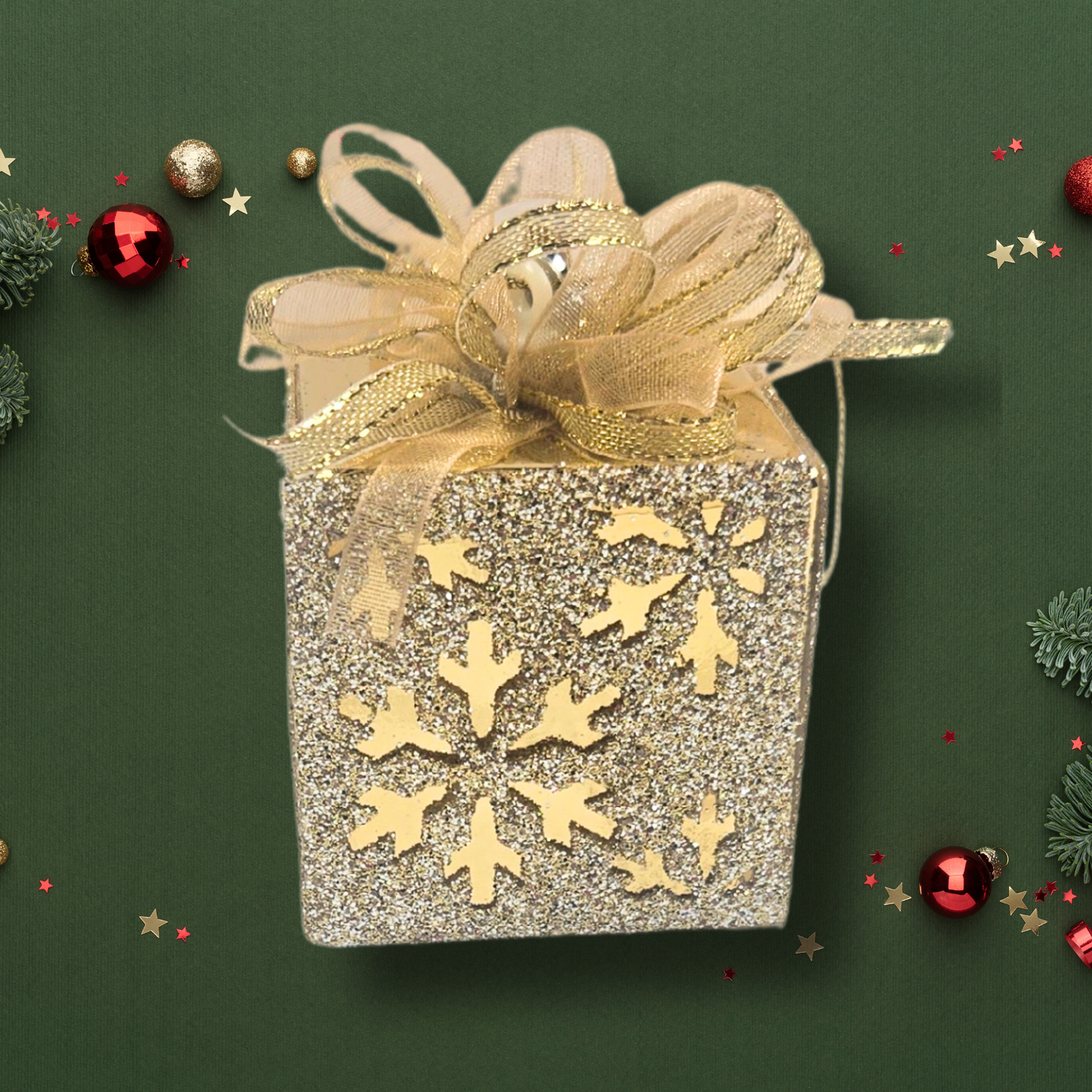 Gold-colored Christmas ornament for rustic gift box.