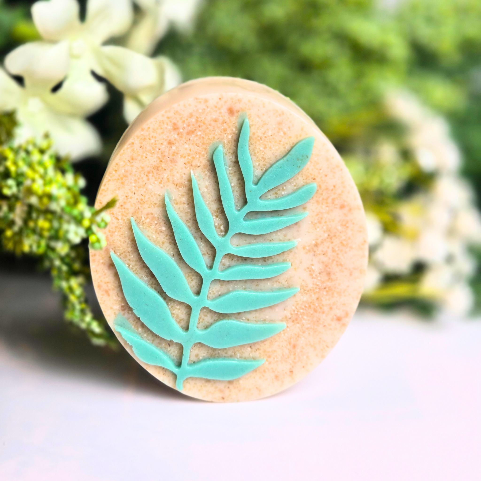 Close-up image of creamy oatmeal soap bars with subtle golden tones from kaolin clay and honey fragrance, front view.