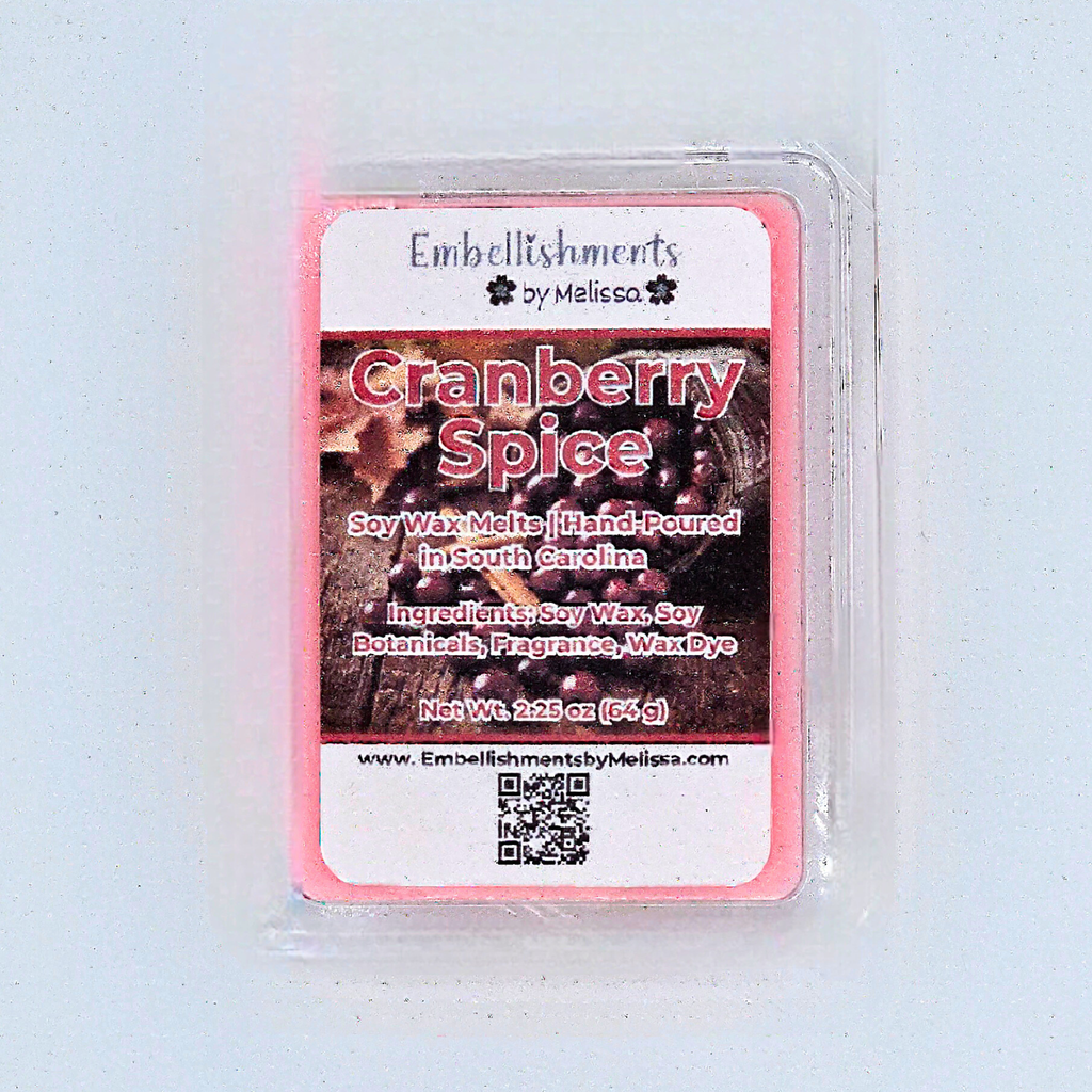 Cranberry Spice wax melt in a clear container with a label on a white background