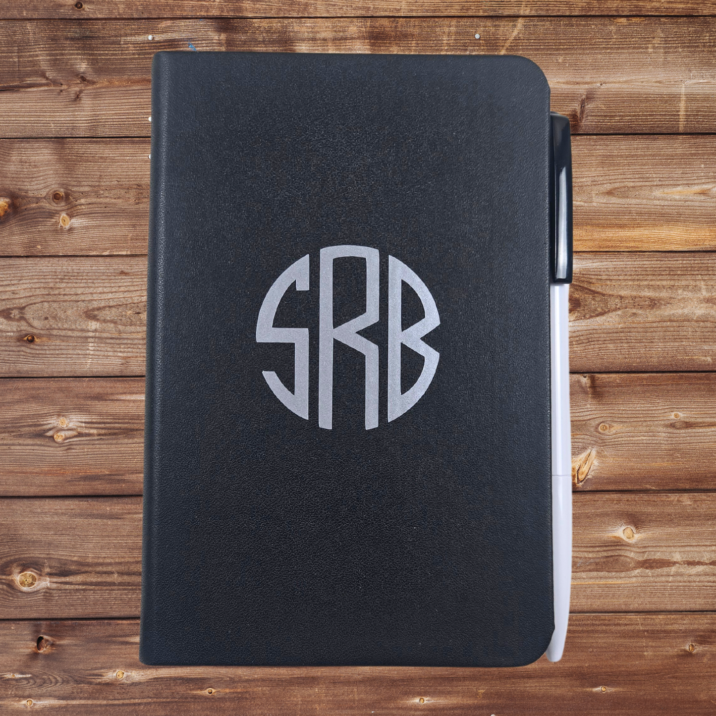 Monogrammed notebook with pen for gift box for him.