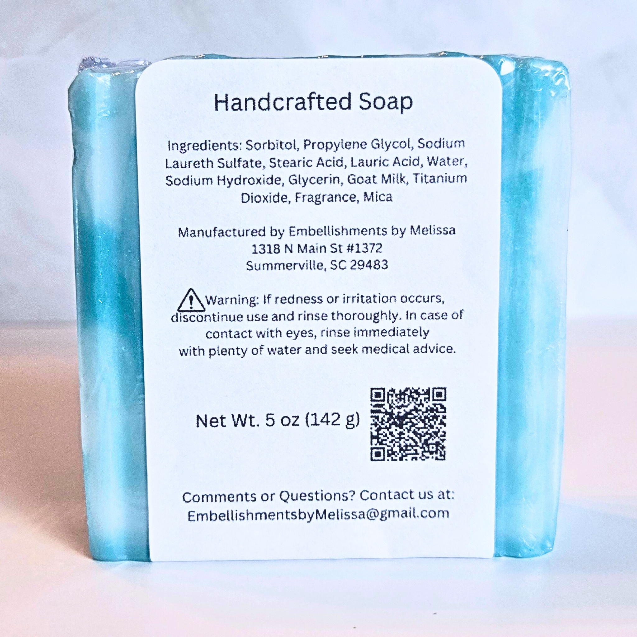 Close-up of Crystal Surf artisan soap showing swirl pattern and smooth finish, back view.