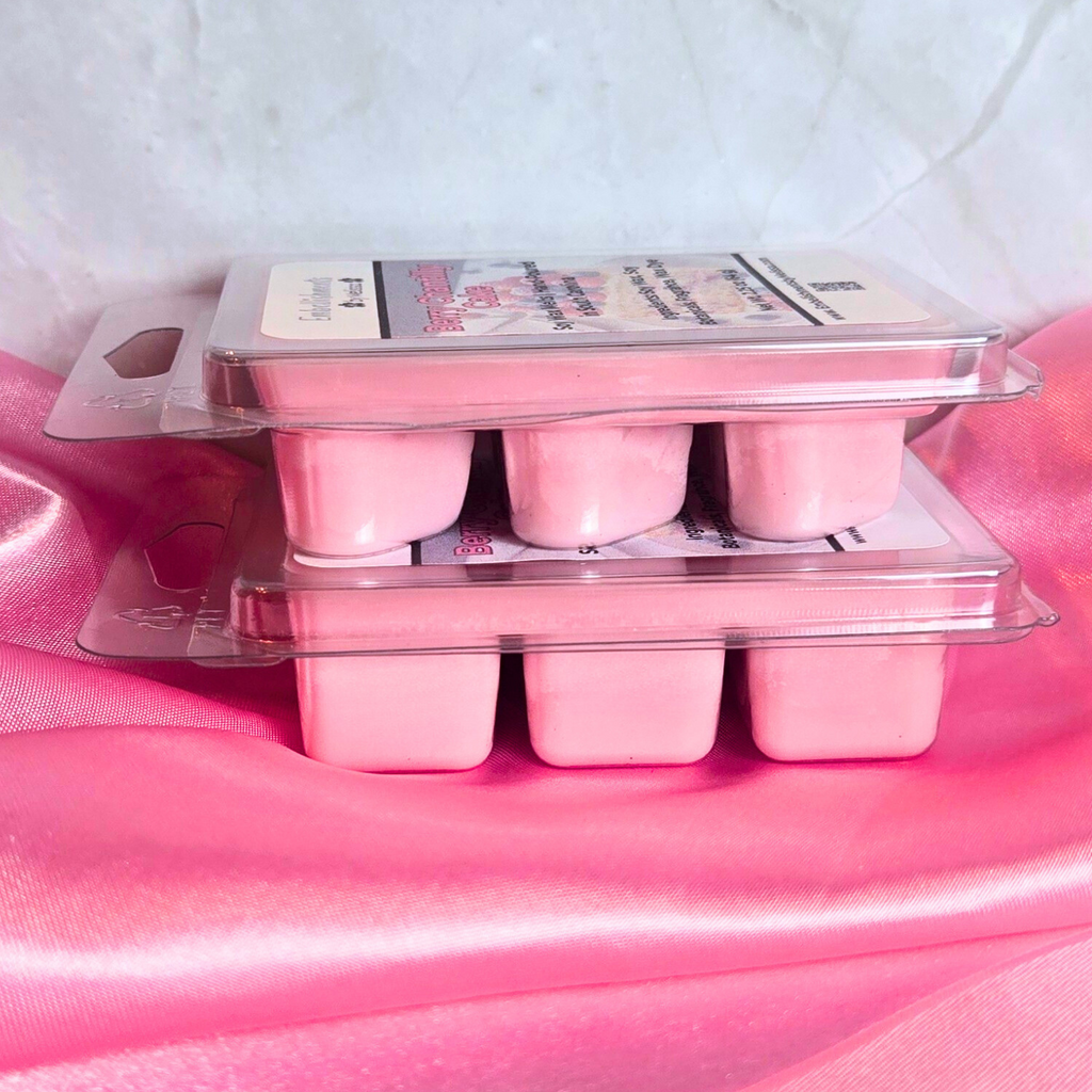 Pink soy wax melts on a pink fabric.