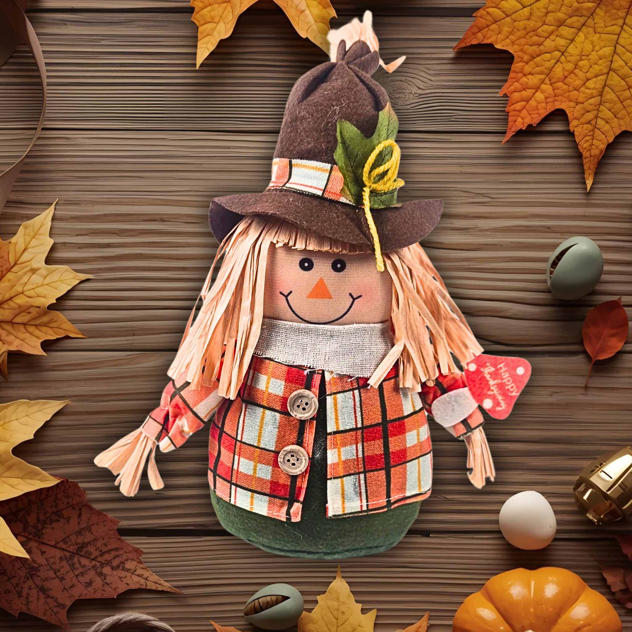 Scarecrow decoration with autumn leaves and pumpkins on a wooden background