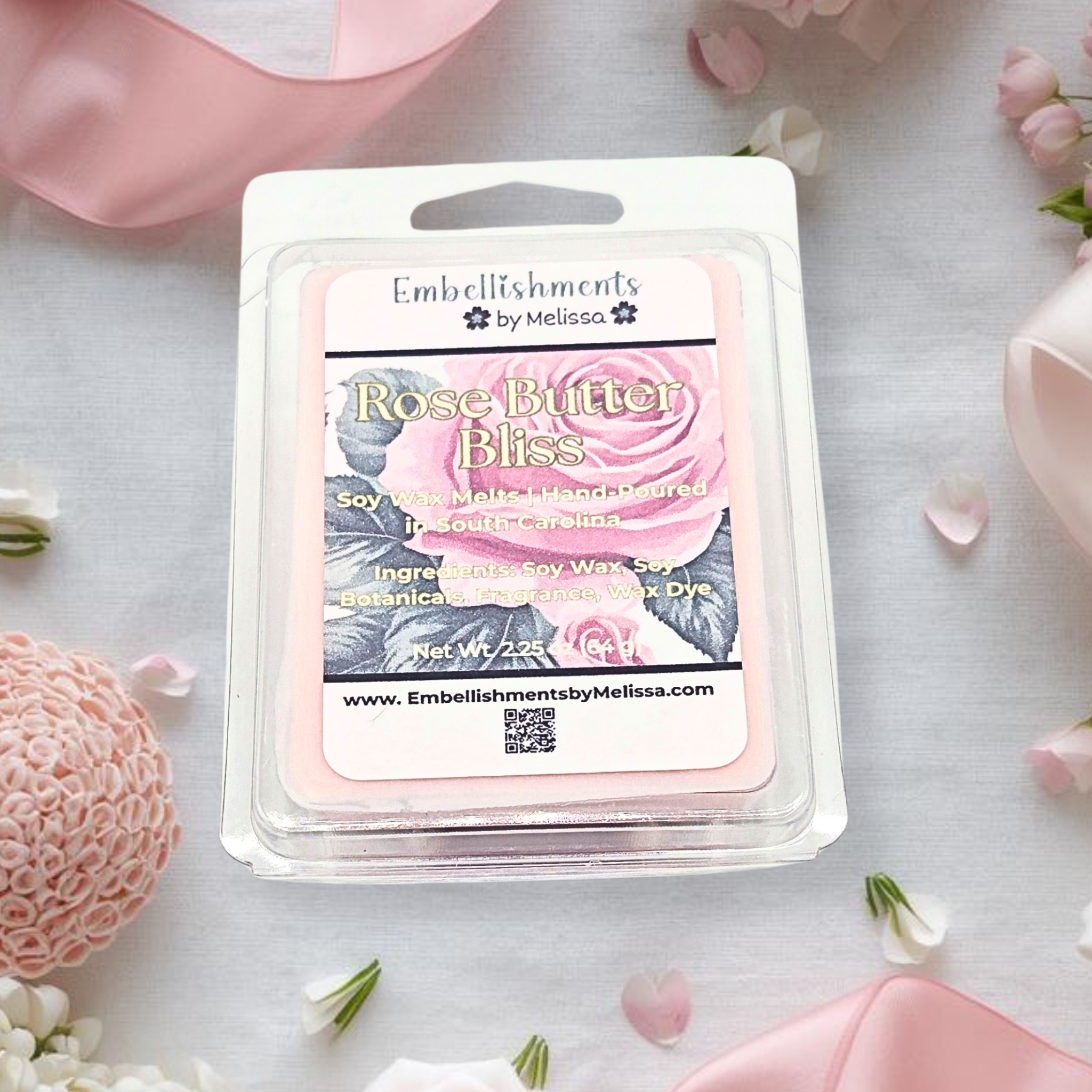 Rose Butter Bliss wax melt package with floral decorations on a light surface