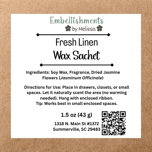 A square white product label for 'Fresh Linen Wax Sachet' by Embellishments by Melissa, displayed on a textured brown kraft paper background. The label details the scent ingredients, usage instructions, product weight.