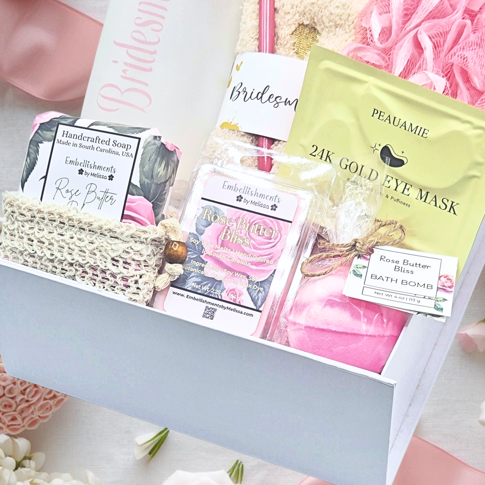 Gift box with beauty products including eye masks and soap on a floral background