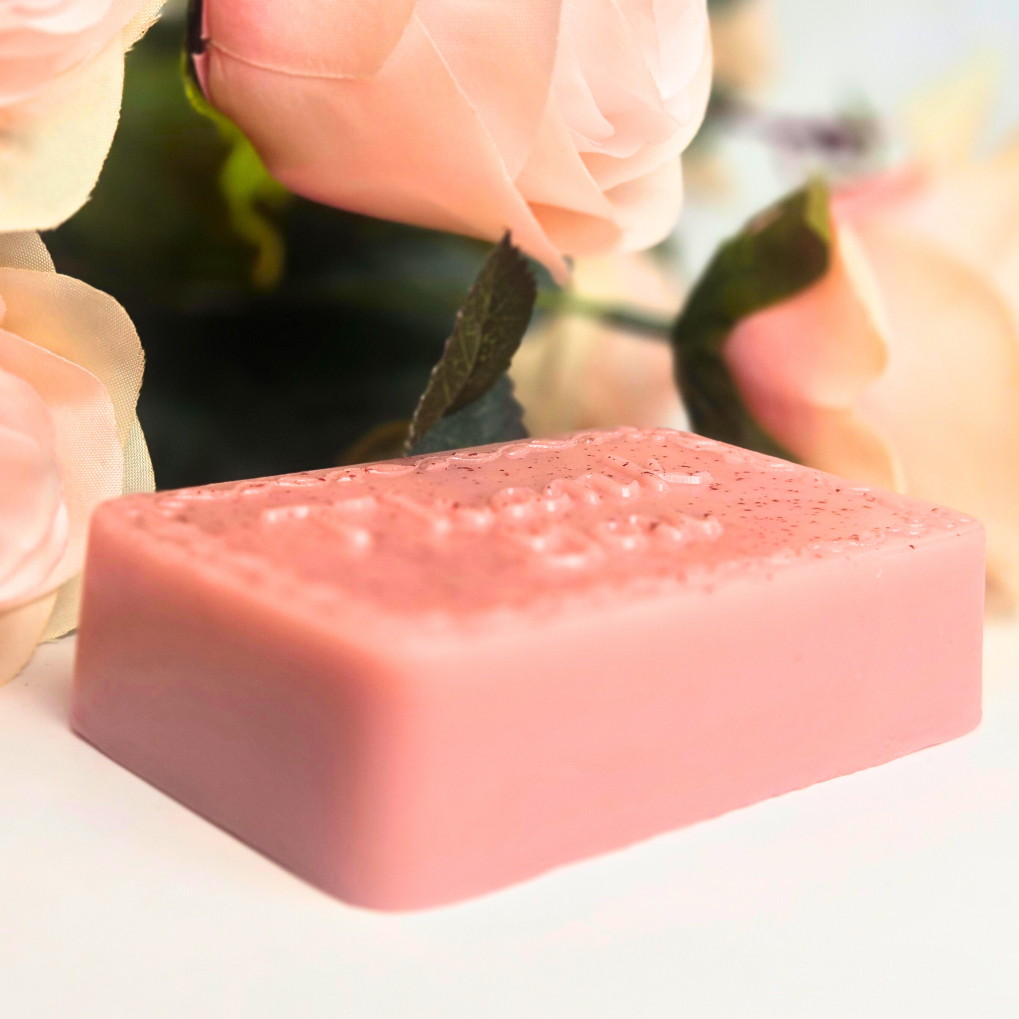 Goat milk soap favor bar with rose kaolin clay, labeled “Thank You” and lightly scented, side view.