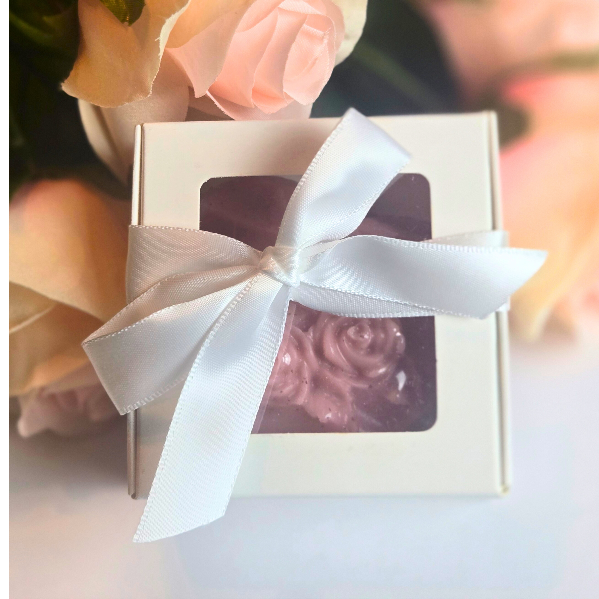 Romantic heart-shaped goat milk soaps for wedding favors, front view.