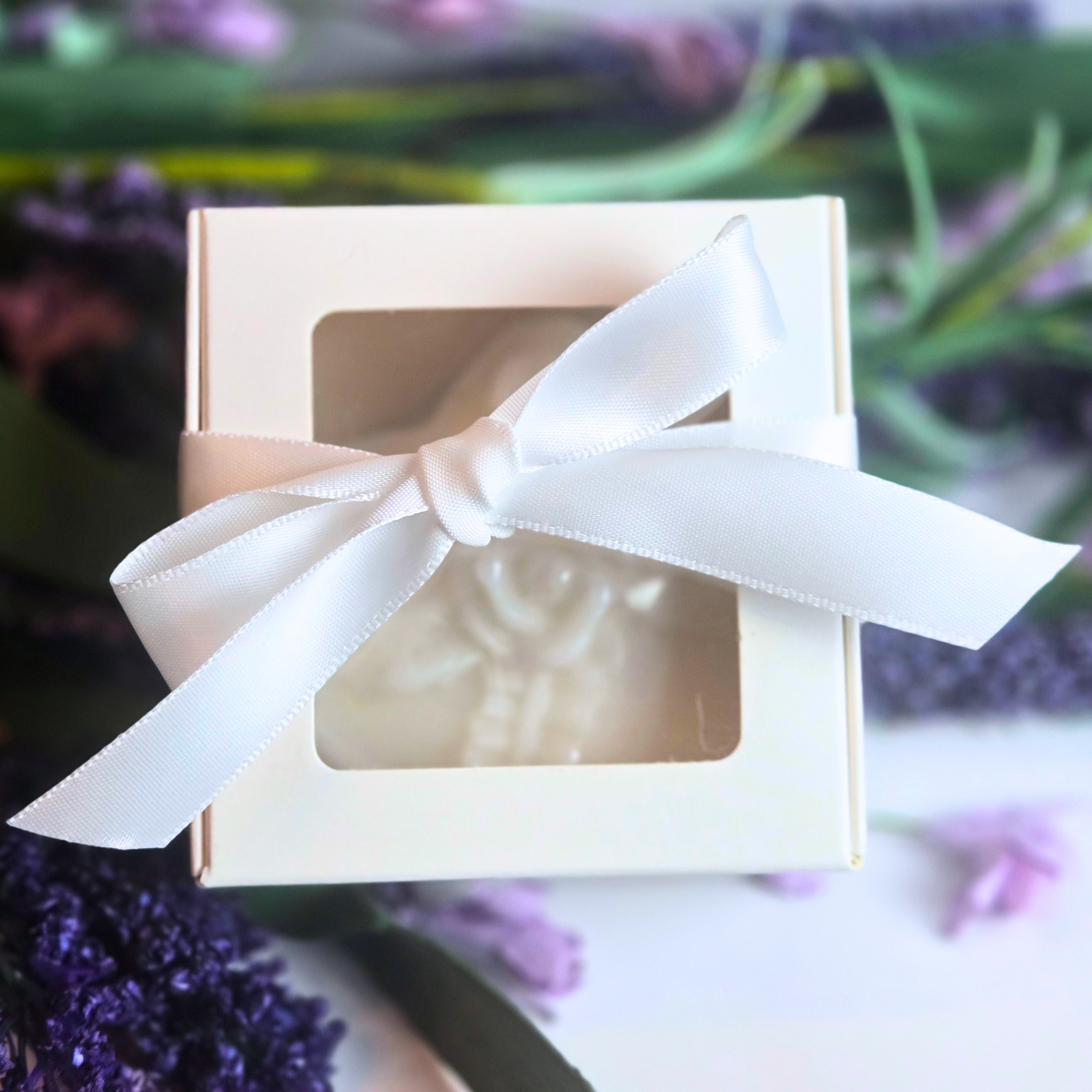 Artisan goat milk soap bars in heart shape with lavender and kaolin clay, front view.