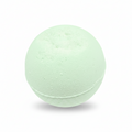 A pale mint green spherical bath bomb with a textured, porous surface, shown on a clean white background with a soft shadow underneath.