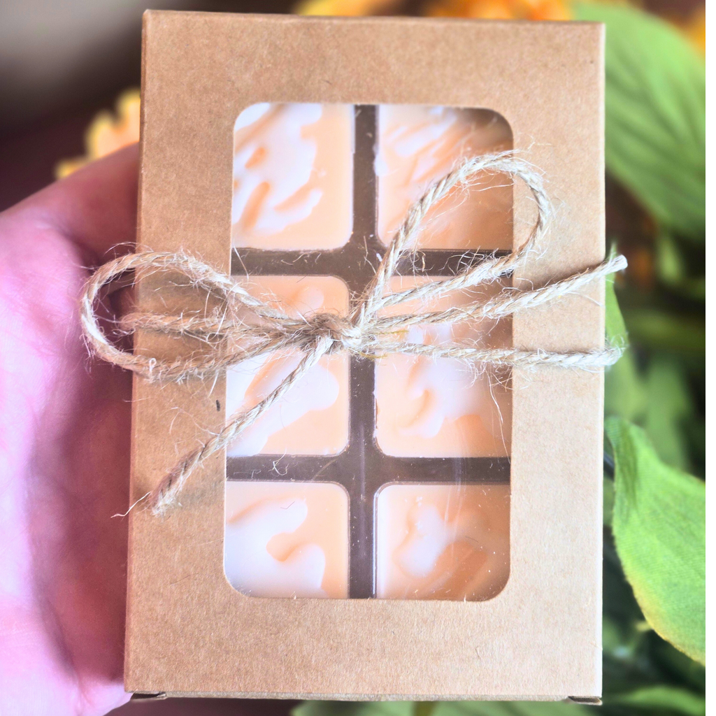 Small wax melt favor with pumpkin cinnamon scent in kraft packaging, front view.