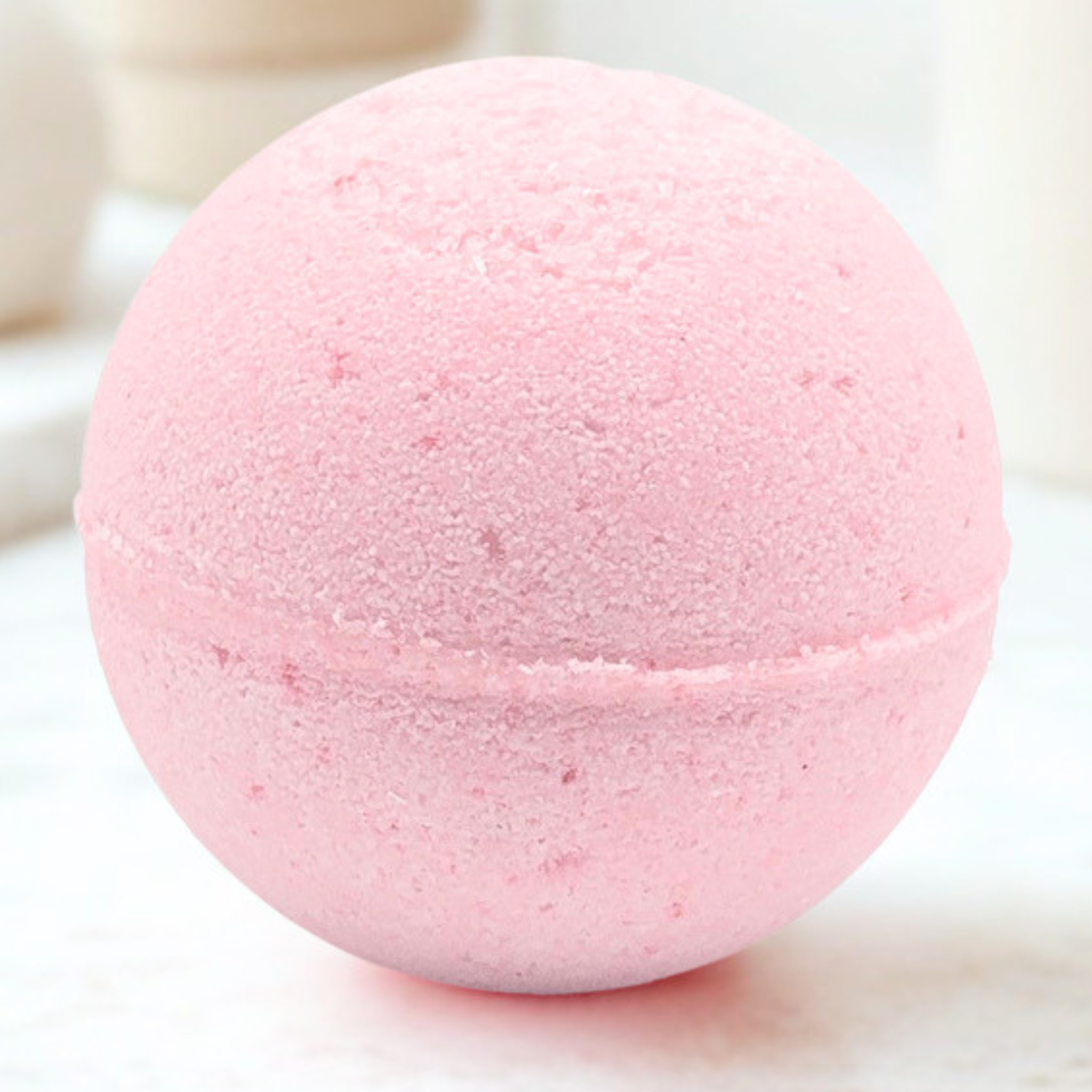 Light pink sphere sitting on light background.