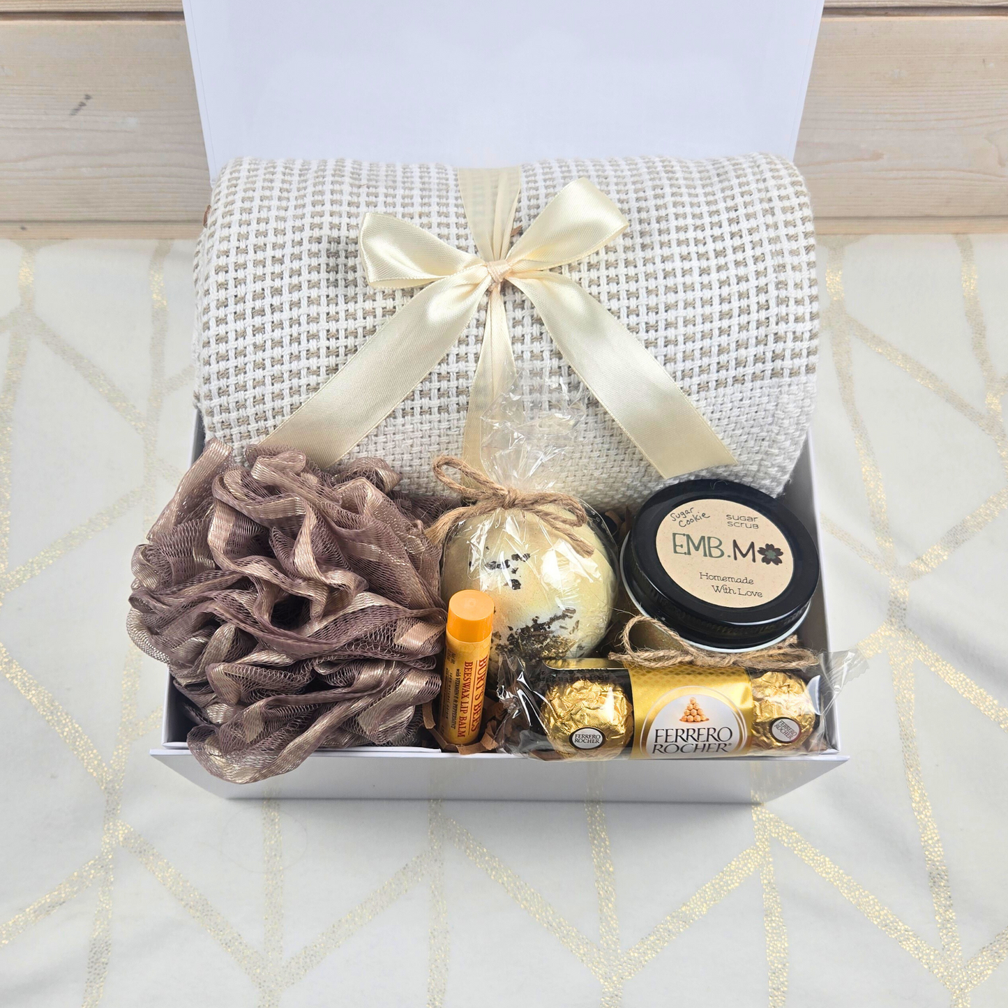 Birthday gift box for her with throw, bath pouf, bath bomb, lip balm, sugar scrub and chocolates.