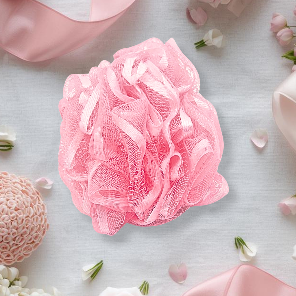 Pink bath pouf on a light gray background with flowers and ribbons.