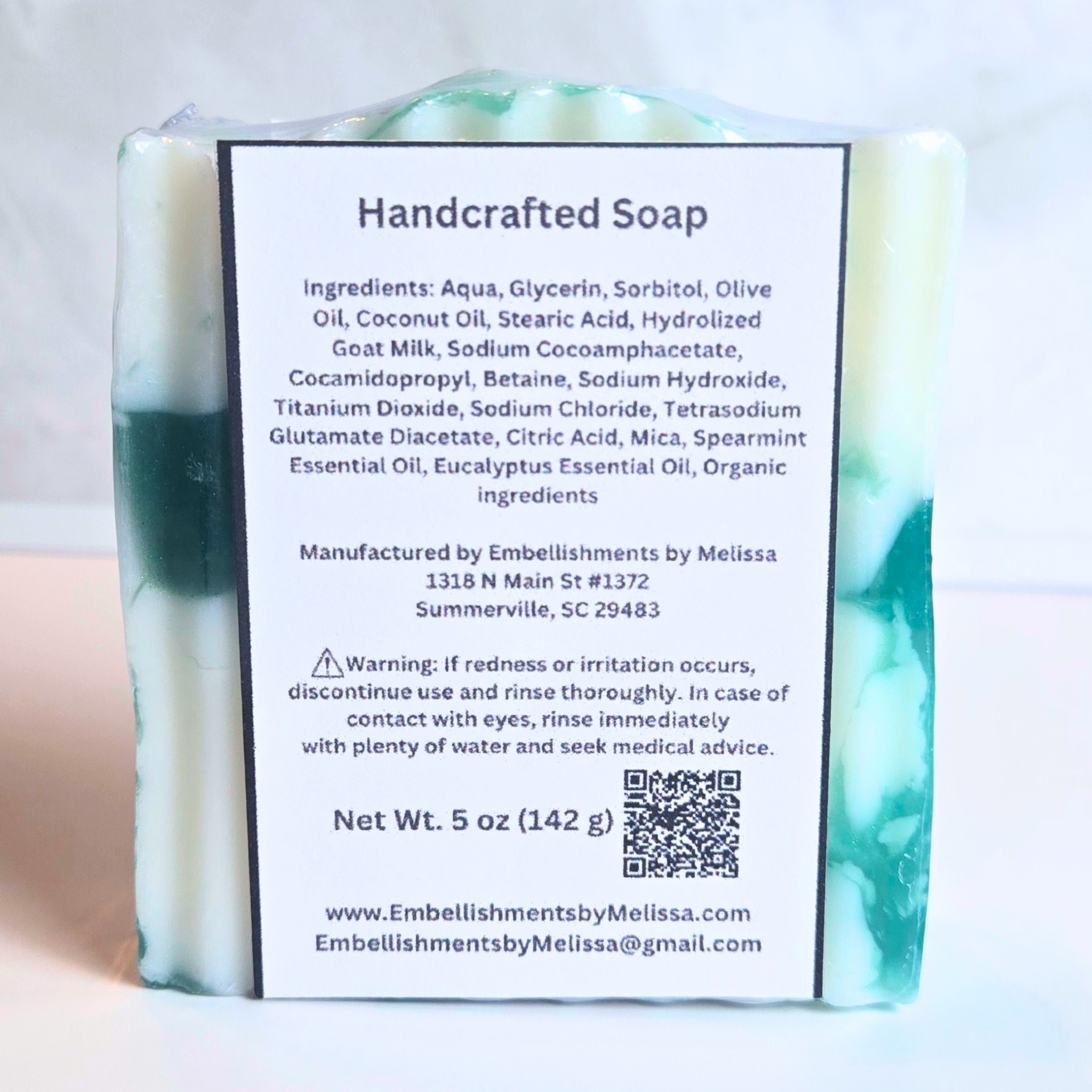 Minty fresh handmade soap featuring a green and white color blend, back view.