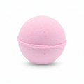A pink spherical bath bomb with a textured, porous surface, shown against a plain white background.