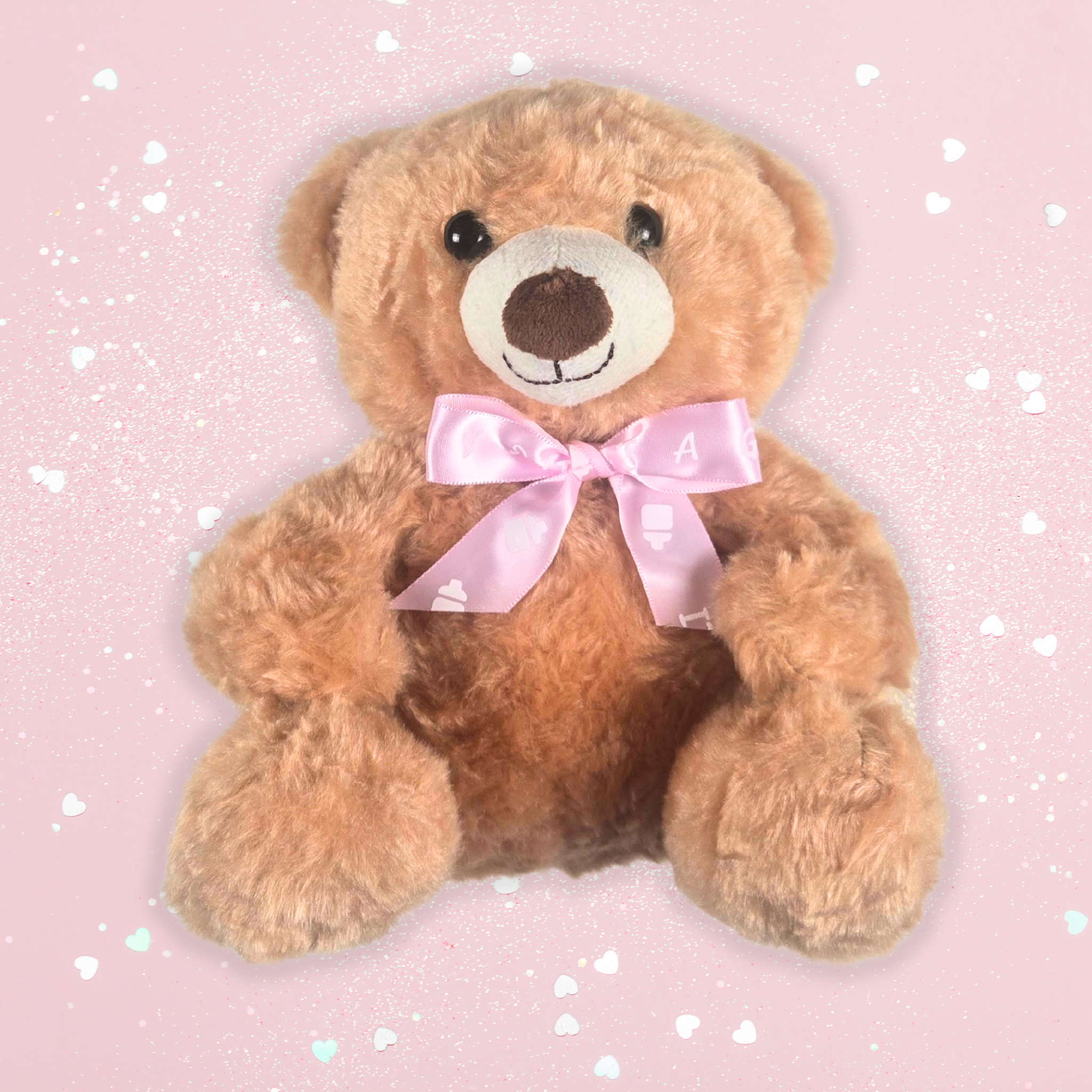 Plush teddy bear with bow, part of newborn baby girl gift set, front view.