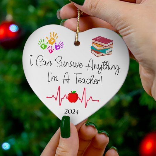 Teach ornament featuring hand prints, a stack of books and an appled centered on an EKG.