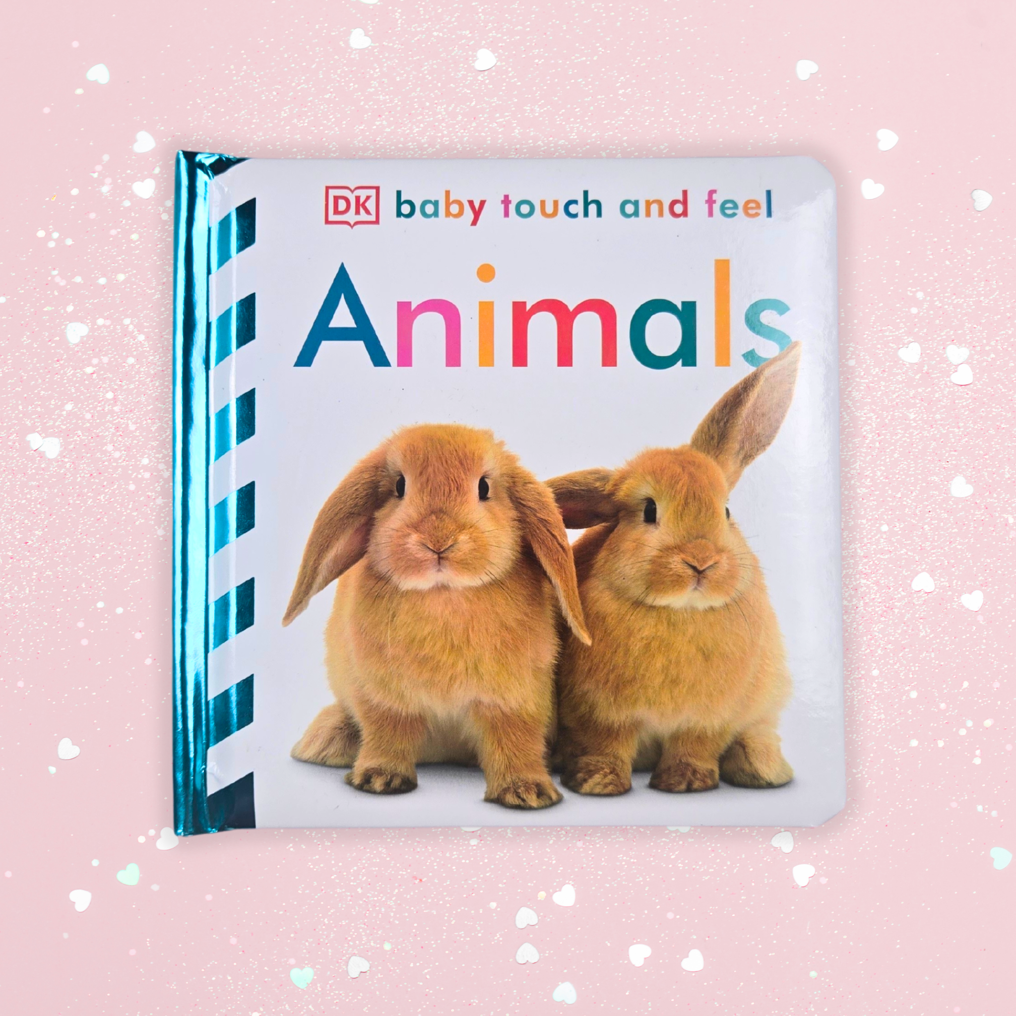 Interactive sensory book for babies, part of baby girl gift set, front view.