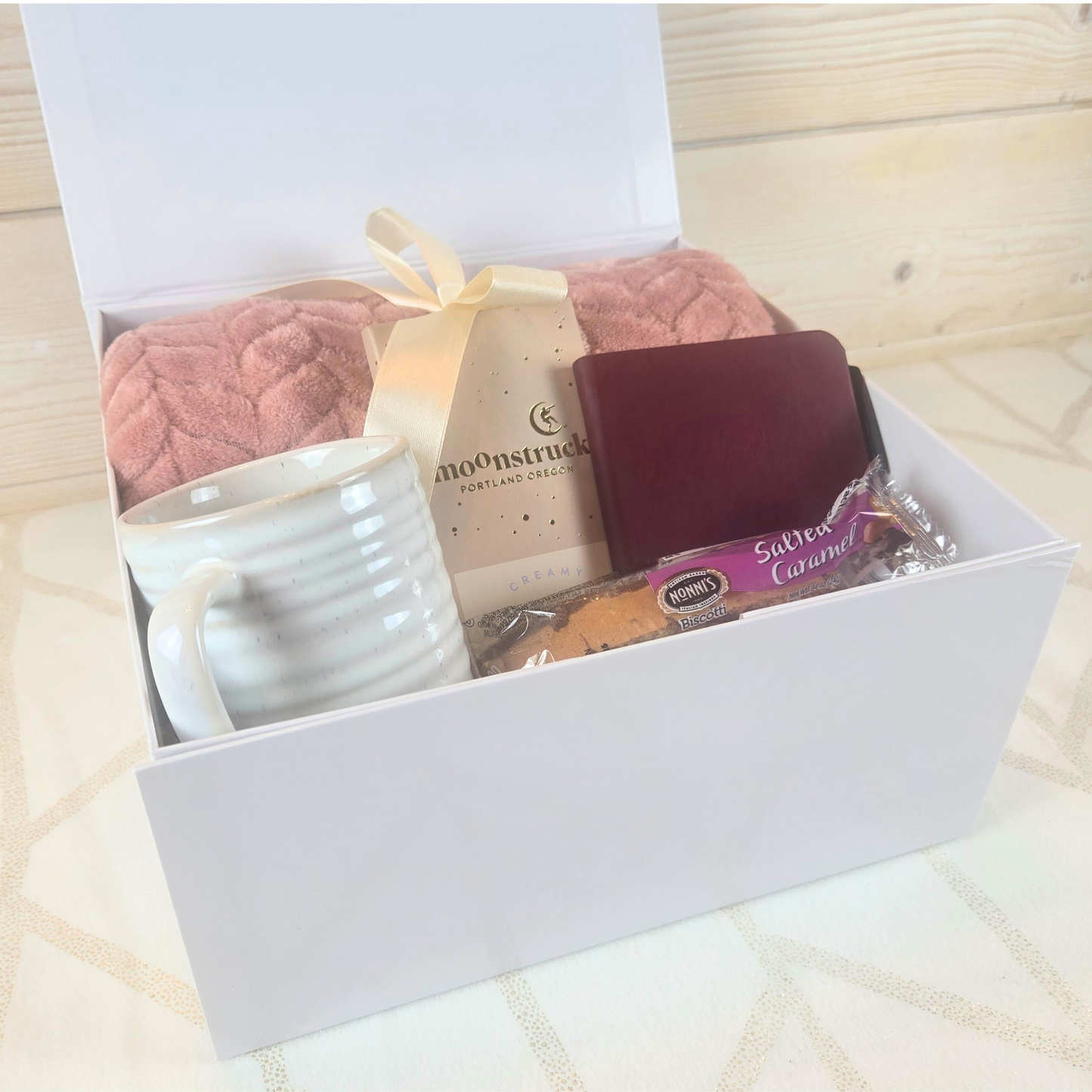 Each item in this Gift Box for Her has been carefully selected to create a warm and inviting atmosphere. Whether she’s cozying up with a good book, sipping her favorite drink, or enjoying a moment of self-reflection, this gift box is a heartfelt reminder of how special she is.