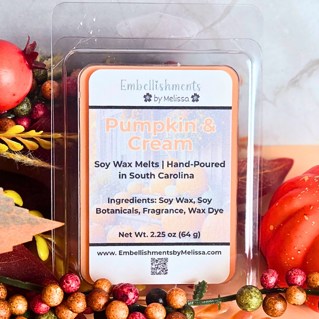 Soy wax melt package labeled 'Pumpkin & Cream' with decorative elements in the background.