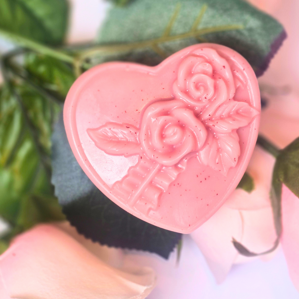 Love Spell fragrance soap bars in heart shapes, set of 8, front view.