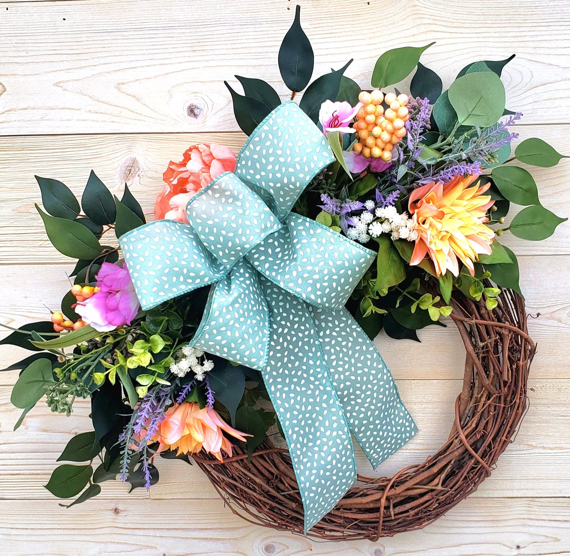 Farmhouse Style Year-Round Faux Floral Wreath with Elegant Blue Bow, front view.