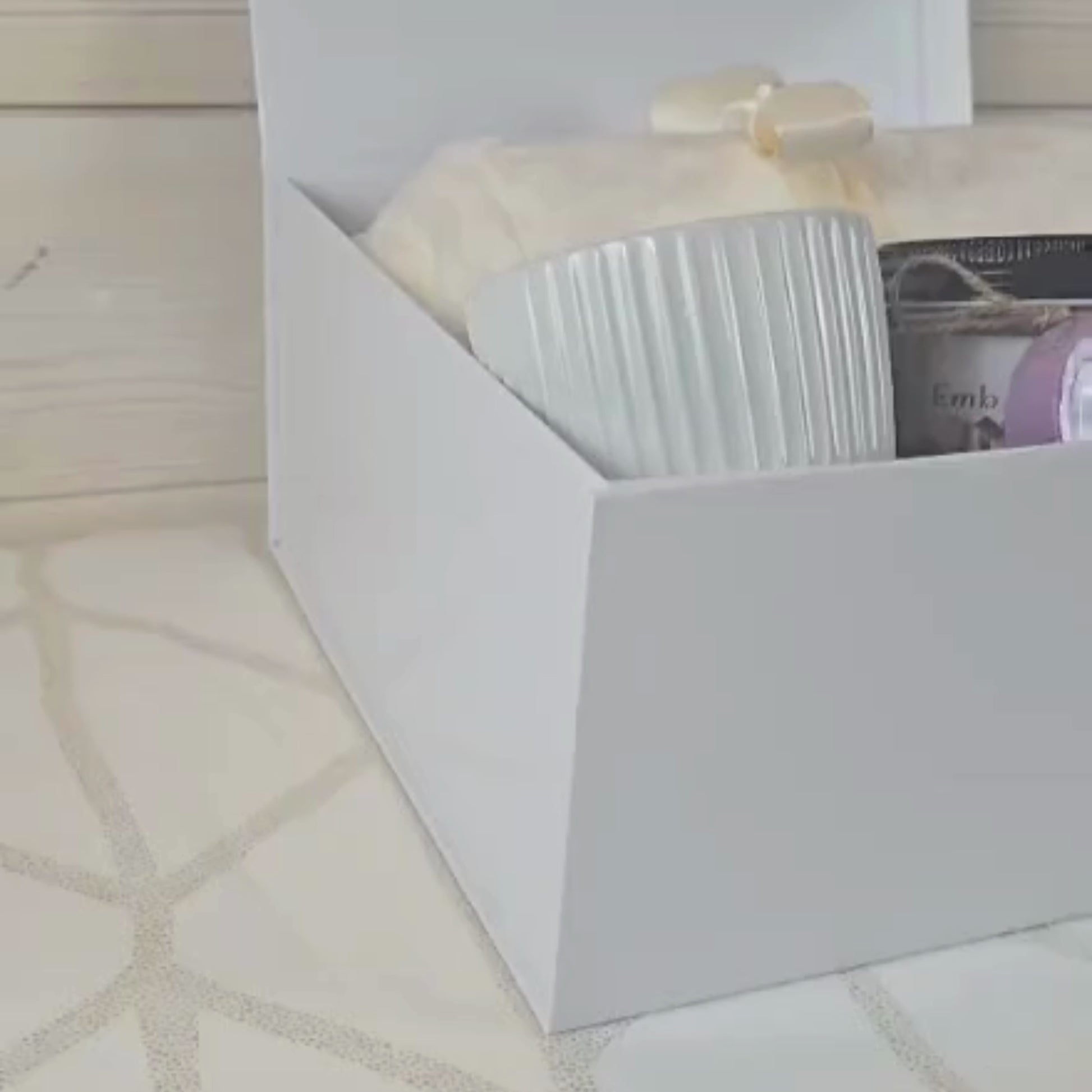 Ultimate Pamper Gift Box for Her. Includes cozy blanket, luxurious body butter, invigorating sugar scrub, stylish mug, and refreshing shower steamers.