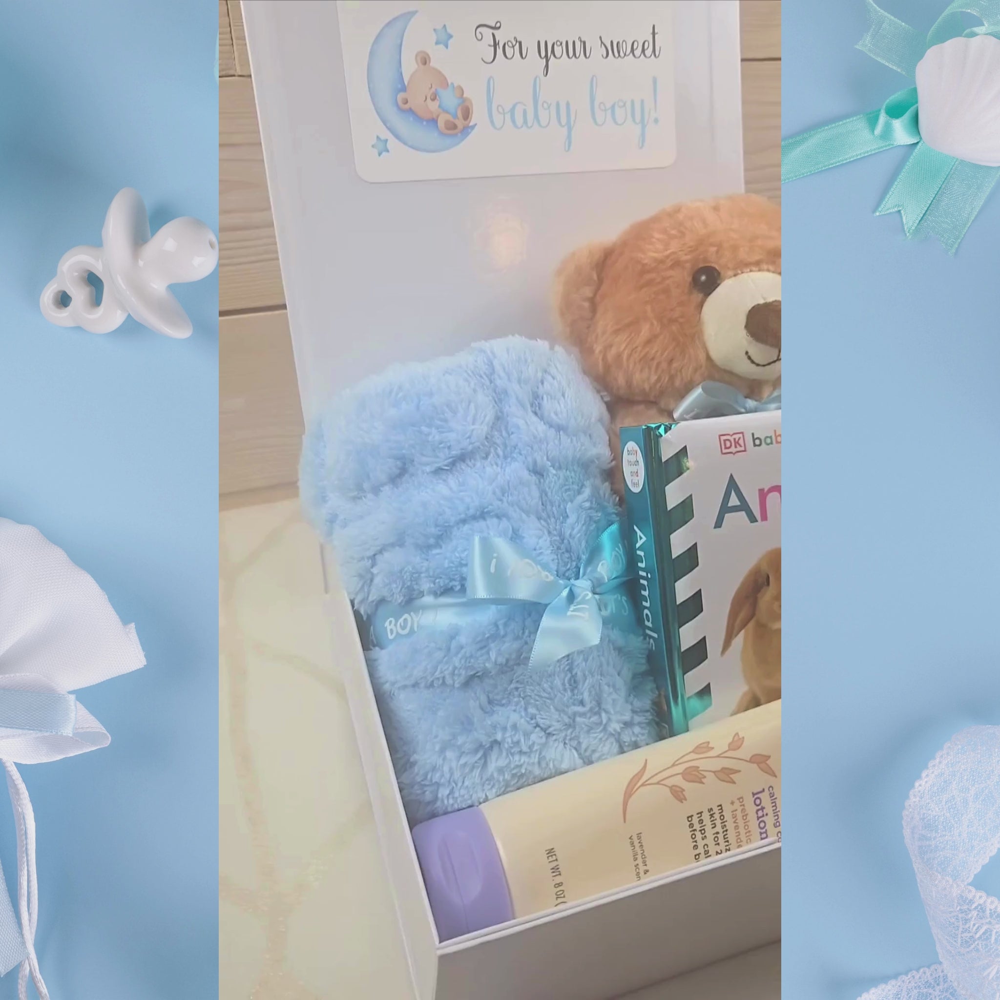 Blue-themed baby boy gift set with stuffed animal, blanket, lotion, and storybook, video.
